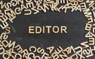 Editor word built with wooden letters